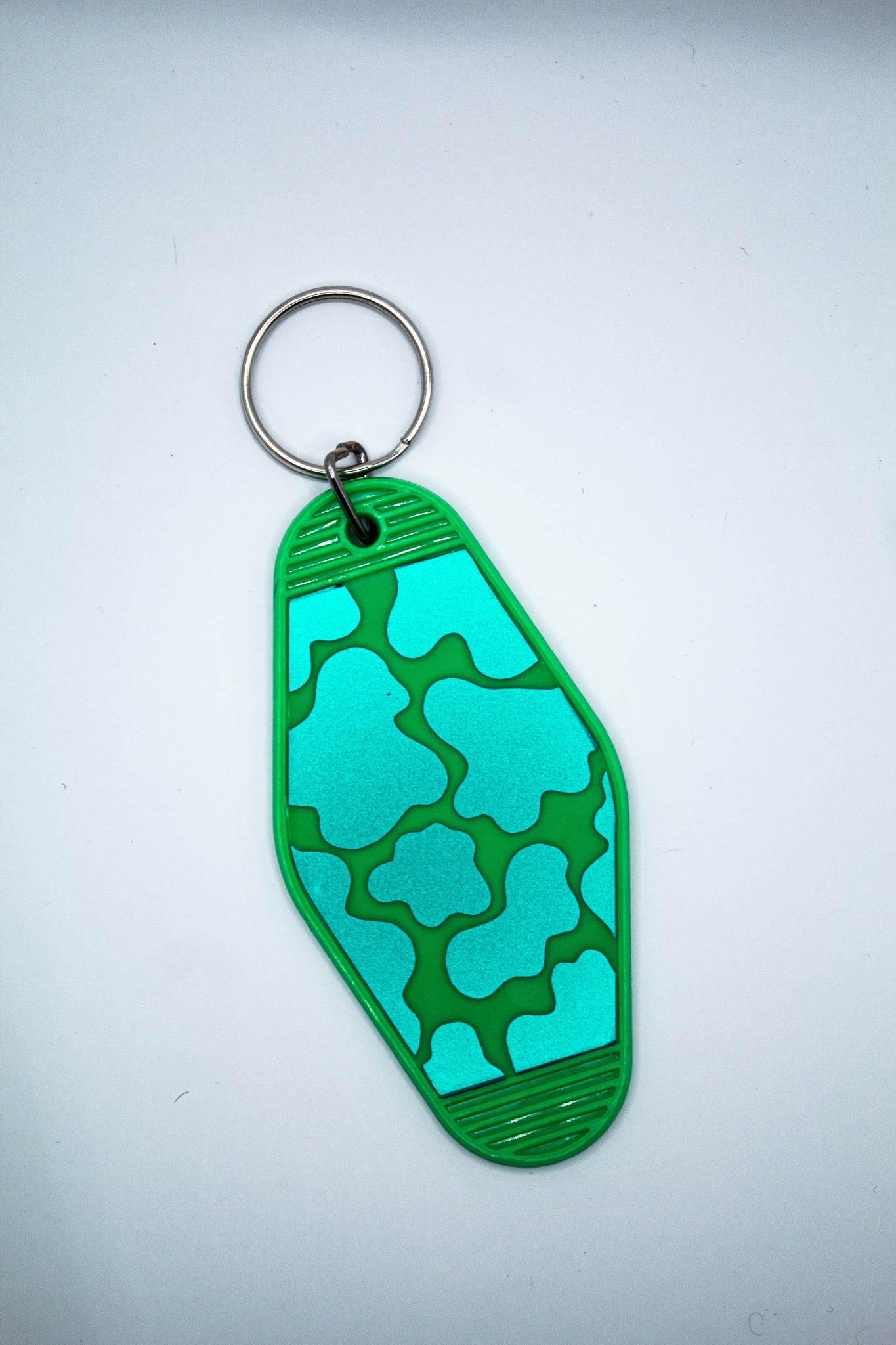 Cow Print Motel Keychain