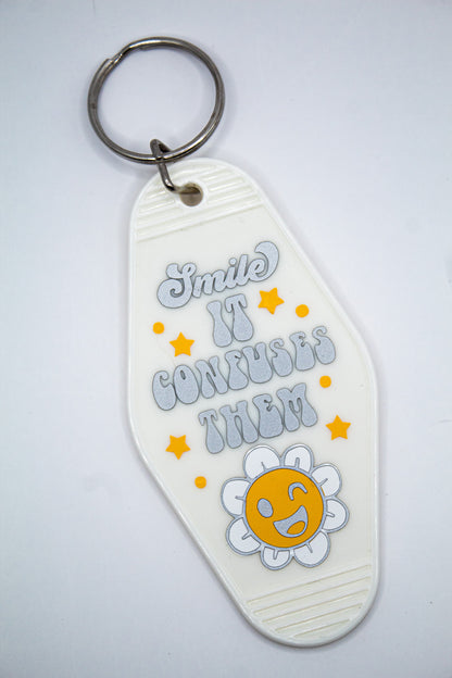 Smile It Confuses Them Motel Keychain