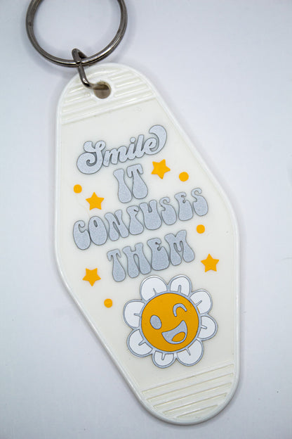 Smile It Confuses Them Motel Keychain